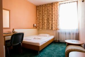 Voodi või voodid majutusasutuse Struma Hotel toas