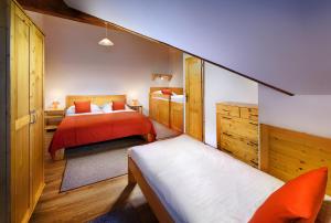 Postel nebo postele na pokoji v ubytování Holiday Village Tatralandia