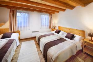 Postel nebo postele na pokoji v ubytování Holiday Village Tatralandia