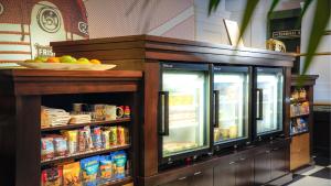 a display case with food and drinks in a restaurant at Hotel Indigo - Kansas City Downtown, an IHG Hotel in Kansas City