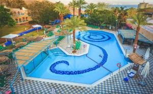 an overhead view of a swimming pool at a resort at Club In Eilat Resort - Executive Deluxe Villa With Jacuzzi, Terrace & Parking in Eilat