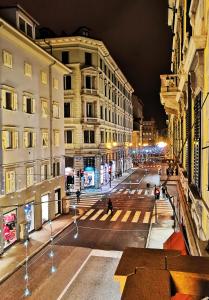 a view of a city street at night at Ricordi di Viaggio, maison retrò in Trieste