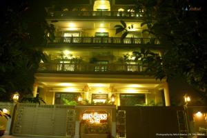 a lit up building with a balcony at night at Jeenmount Heritage Boutique Hotel in Jaipur