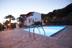a swimming pool in front of a villa at Villa Michalis in Istro