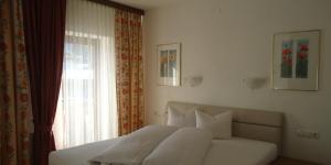 Posteľ alebo postele v izbe v ubytovaní Landhaus Klausnerhof Hotel Garni