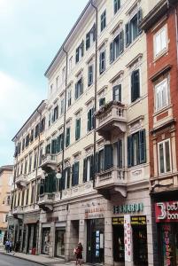 a large building on the side of a street at Ricordi di Viaggio, maison retrò in Trieste