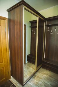 a closet with a mirror in a room at База відпочинку ЕЛЬДОРАДО in Solochyn