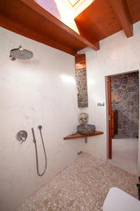 a bathroom with a shower and a sink at La Molina NK in Tindaya