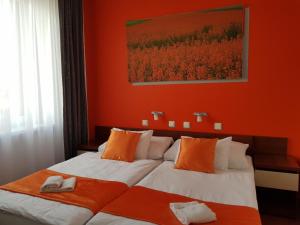 Postel nebo postele na pokoji v ubytování Hotel Color
