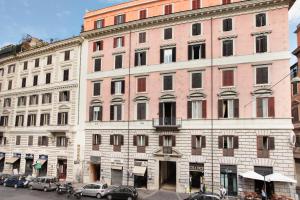 a large brick building with cars parked in front of it at HS 311 in Rome