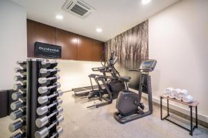 a gym with three exercise bikes and a treadmill at Occidental Vigo in Vigo