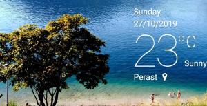 a poster for a beach with a tree and people on the beach at Apartment Mediterraneo Blue Sky in Perast