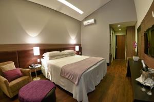 Cama ou camas em um quarto em Cordilheira Hotel