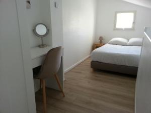 En eller flere senge i et værelse på Maison proche Golf plage et piscine à Pornic