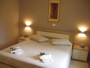 Posteľ alebo postele v izbe v ubytovaní Ane Apartment