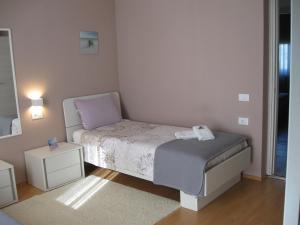 Posteľ alebo postele v izbe v ubytovaní Ane Apartment