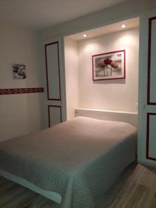 Postel nebo postele na pokoji v ubytování Hotel Le Beauregard