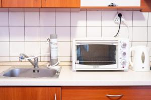 Kuchyňa alebo kuchynka v ubytovaní Tip-Top Apartman Ház