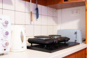 Kuchyňa alebo kuchynka v ubytovaní Tip-Top Apartman Ház