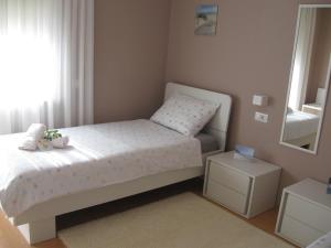 Posteľ alebo postele v izbe v ubytovaní Ane Apartment