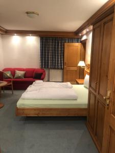 Letto o letti in una camera di Alpenhotel Widderstein