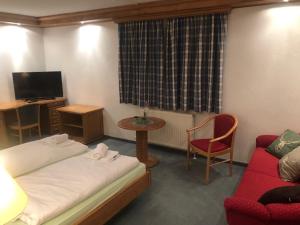 TV o dispositivi per l'intrattenimento presso Alpenhotel Widderstein