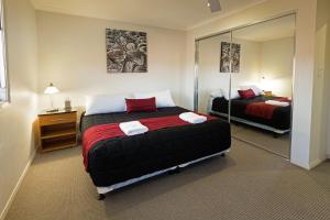 Ένα ή περισσότερα κρεβάτια σε δωμάτιο στο Cardiff Executive Apartments