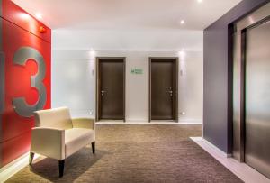 Uma área de estar em RR Hotel da Rocha