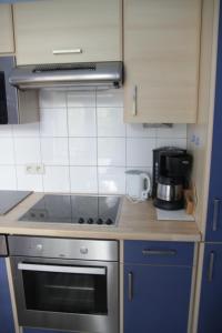 Cuisine ou kitchenette dans l'établissement Gîte de la Conciergerie du Cheval Blanc