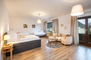 A bed or beds in a room at Das Landhaus