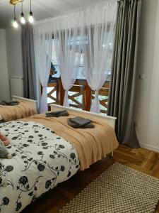 Apartament Gaia tesisinde bir odada yatak veya yataklar