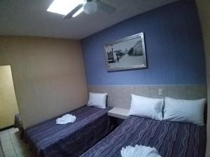 Postel nebo postele na pokoji v ubytování Hotel Aguila + 4 fotografie