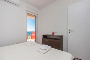 Posteľ alebo postele v izbe v ubytovaní Villa top of Murter, one bedroom apartment