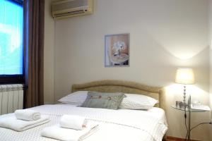 Postel nebo postele na pokoji v ubytování Villa Quantum Beograd