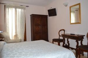 Posteľ alebo postele v izbe v ubytovaní Hotel Locanda Salieri