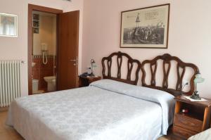 Кровать или кровати в номере Hotel Locanda Salieri