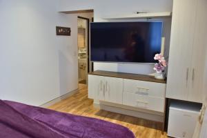 TV a/nebo společenská místnost v ubytování Casa Lua Hotel Spa