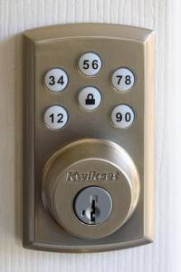 a remote control with numbers on it on a wall at Chic Apartment in Los Angeles