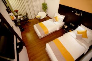 Postel nebo postele na pokoji v ubytování Astoria Hotels Madurai