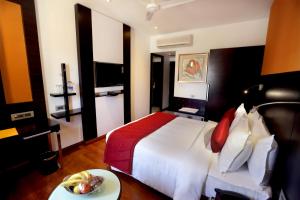 Postel nebo postele na pokoji v ubytování Astoria Hotels Madurai