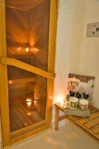 a room with a wooden bunk bed with candles at Casa Lua Hotel Spa in Chía