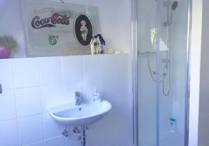 a bathroom with a sink and a shower at Sweet Home in Willich