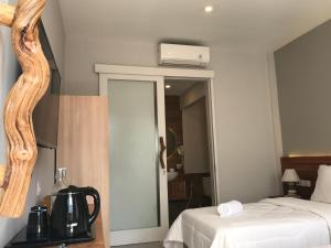 Letto o letti in una camera di Mantra Gili