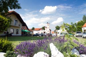 a field of purple flowers in a town at Guest House Pri Treh Lipah in Ptuj