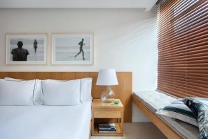 Кровать или кровати в номере JANEIRO Hotel