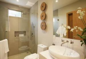 a bathroom with a sink and a toilet and a shower at Trichada Villas by RESAVA in Bang Tao Beach +52 photos