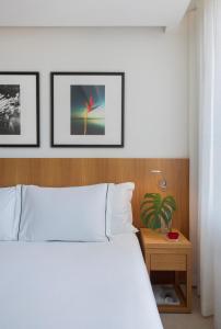 Кровать или кровати в номере JANEIRO Hotel
