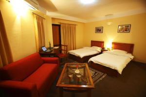 Letto o letti in una camera di Royal Astoria Hotel