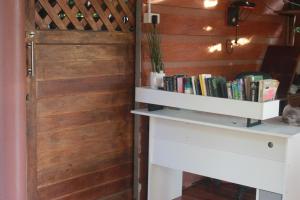 a room with a book shelf with books at Phusam Big Resort in Ko Mook