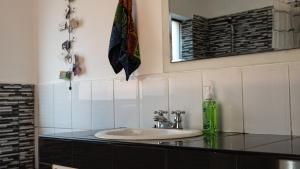 a bathroom with a sink and a mirror at House in Cusco in Cusco